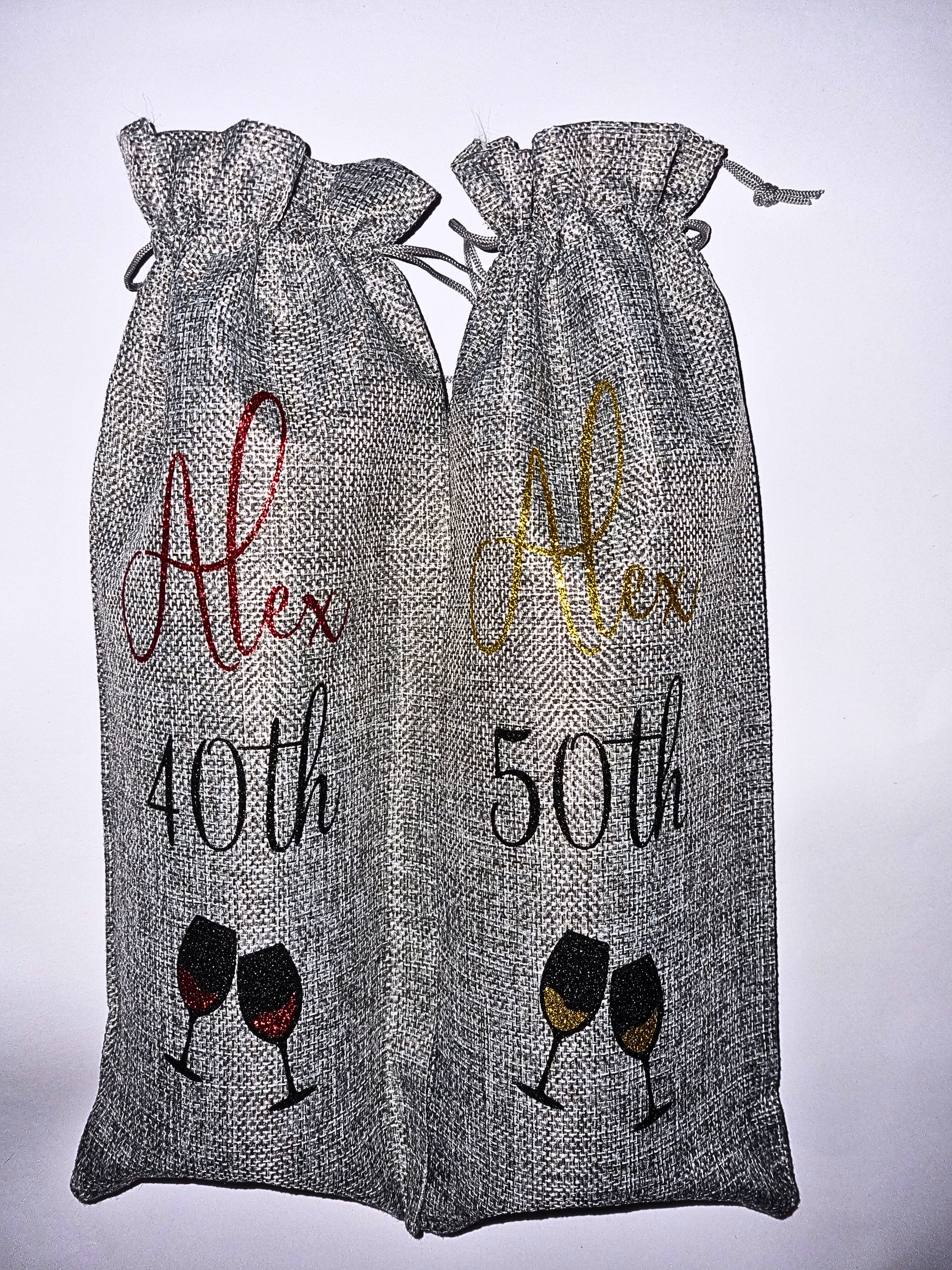 Two grey drawstring bags with personalised text and wine glass graphics on a white background.