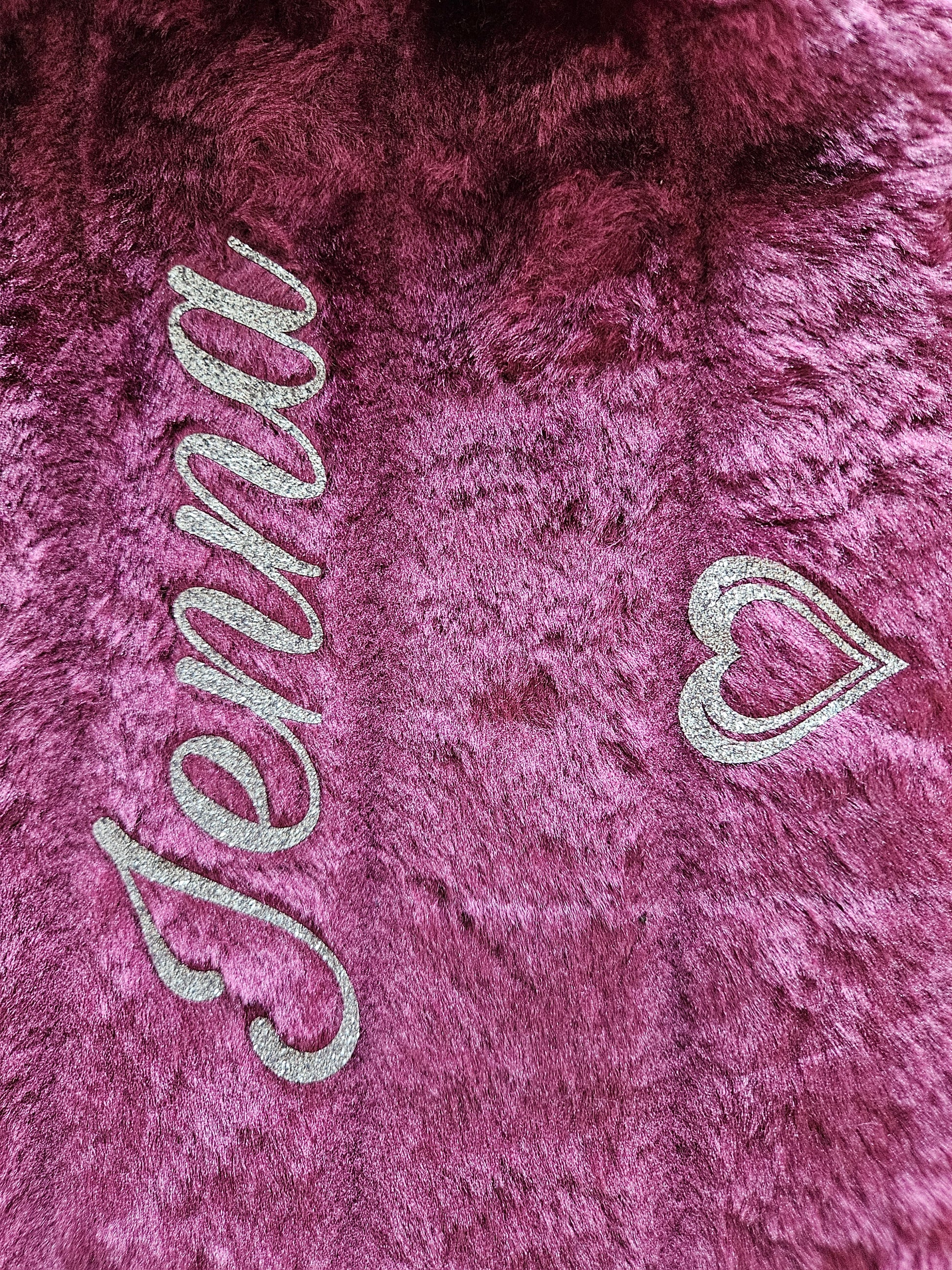 Plum plush faux fur cover with silver heart and 'Jenna' vinyl text with heart feature