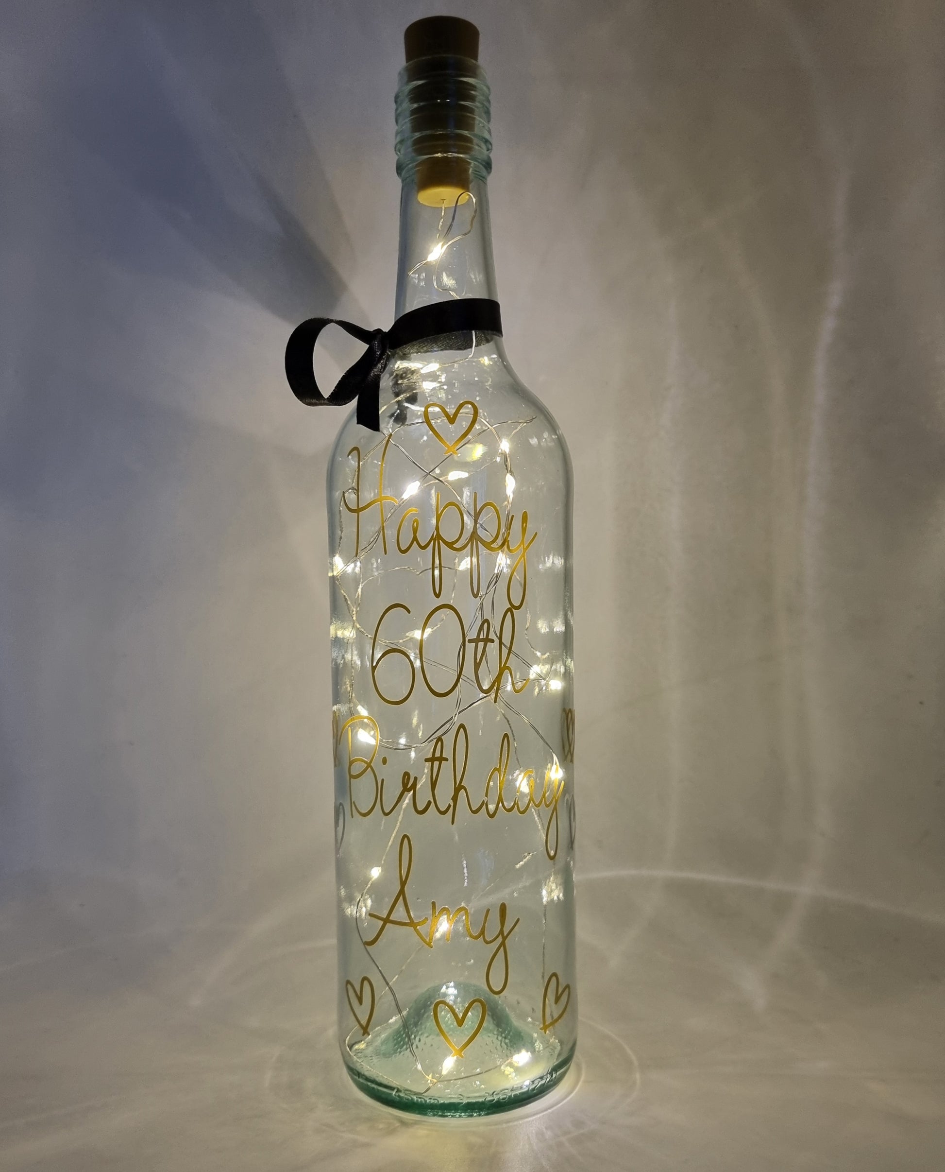 Elegant personalised LED bottle, custom light-up design, in a classic glossy gold vinyl, beautifully gift wrapped