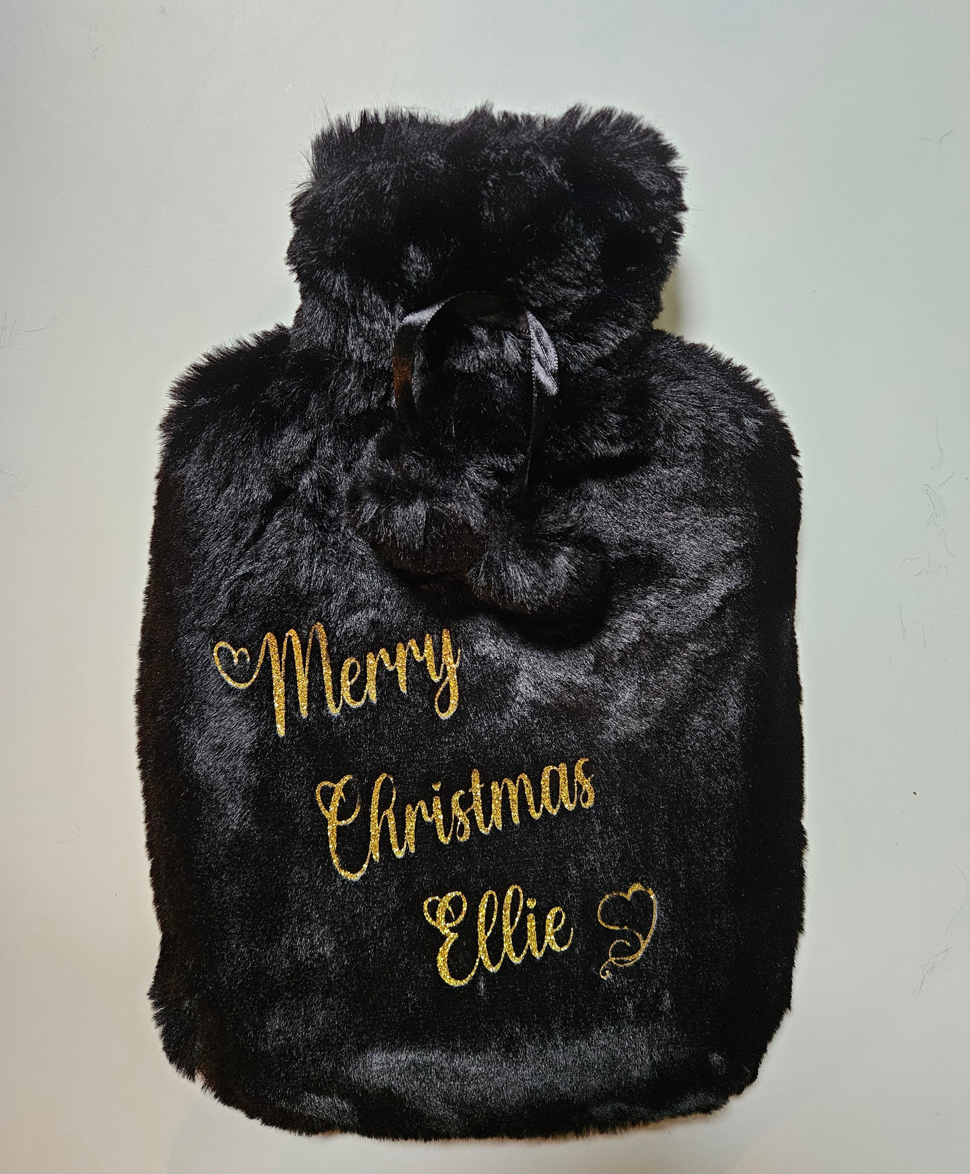 Stay cosy and warm this winter with our luxury personalised xmas hot water bottles. Featuring ultra soft removable covers with pom poms.