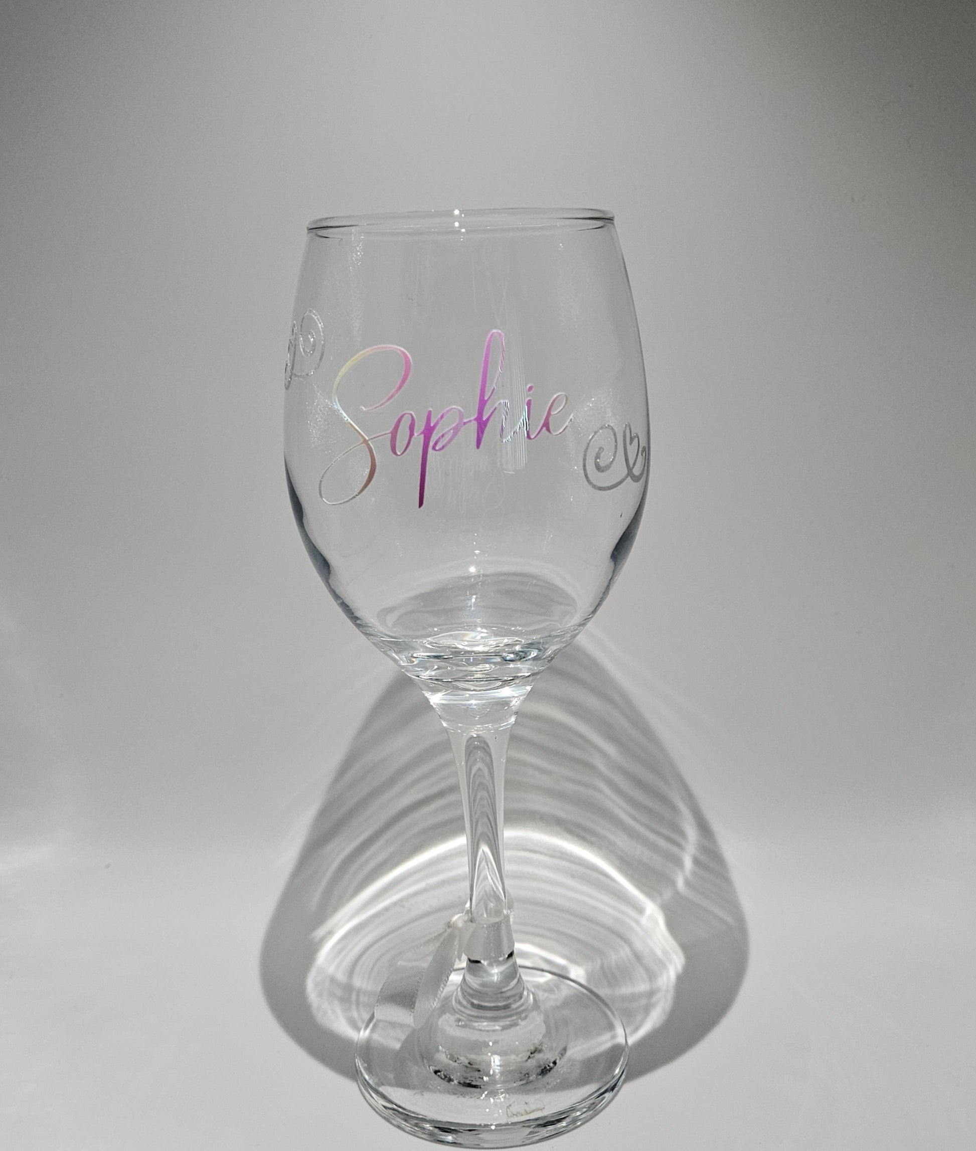 Discover our custom made colour changing wine glasses, perfect for birthday gifts that are offered in 6 different stunning holographic colours. Featuring an elegant script design, this innovative vinyl creates a mesmerising display of colours that shift and dance with every angle, making each glass a unique and captivating work of art.