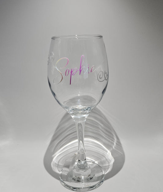 Discover our custom made colour changing wine glasses, perfect for birthday gifts that are offered in 6 different stunning holographic colours. Featuring an elegant script design, this innovative vinyl creates a mesmerising display of colours that shift and dance with every angle, making each glass a unique and captivating work of art.