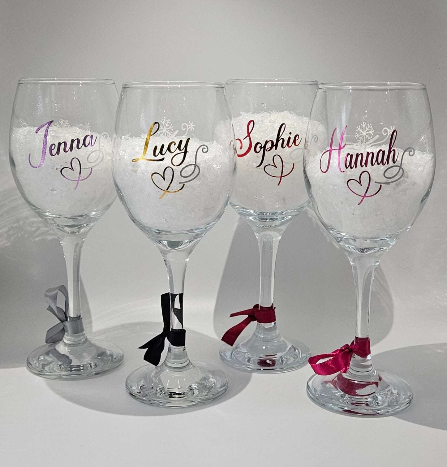 Celebrate the magic of Christmas with our beautifully personalised xmas wine glasses -expertly crafted to bring a touch of sophistication to your holiday gatherings. Each glass features a new elegant script font in your choice of vibrant, premium holographic/chrome vinyls. 