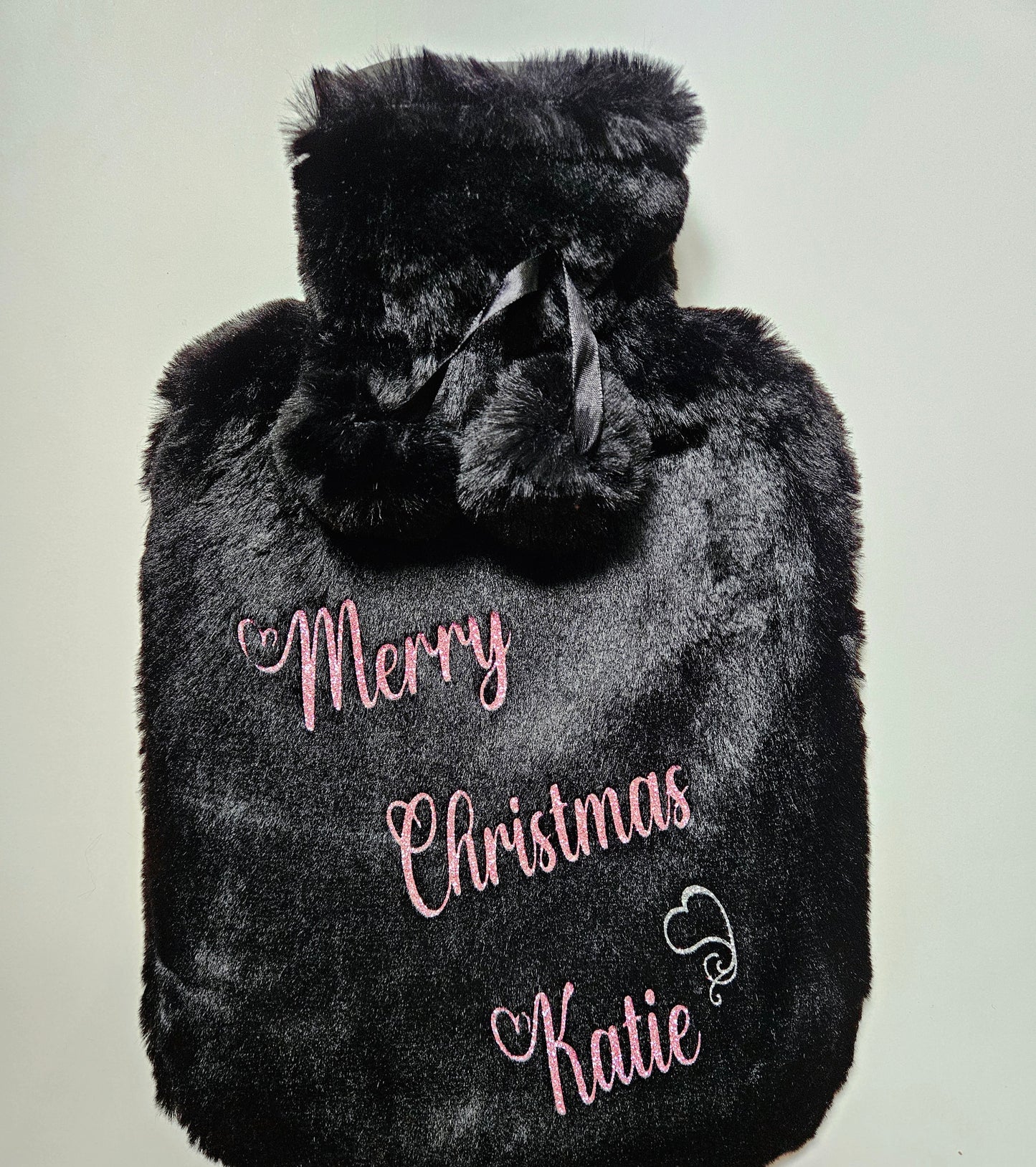 Stay cosy and warm this winter with our luxury personalised xmas hot water bottles. Featuring ultra soft removable covers with pom poms.