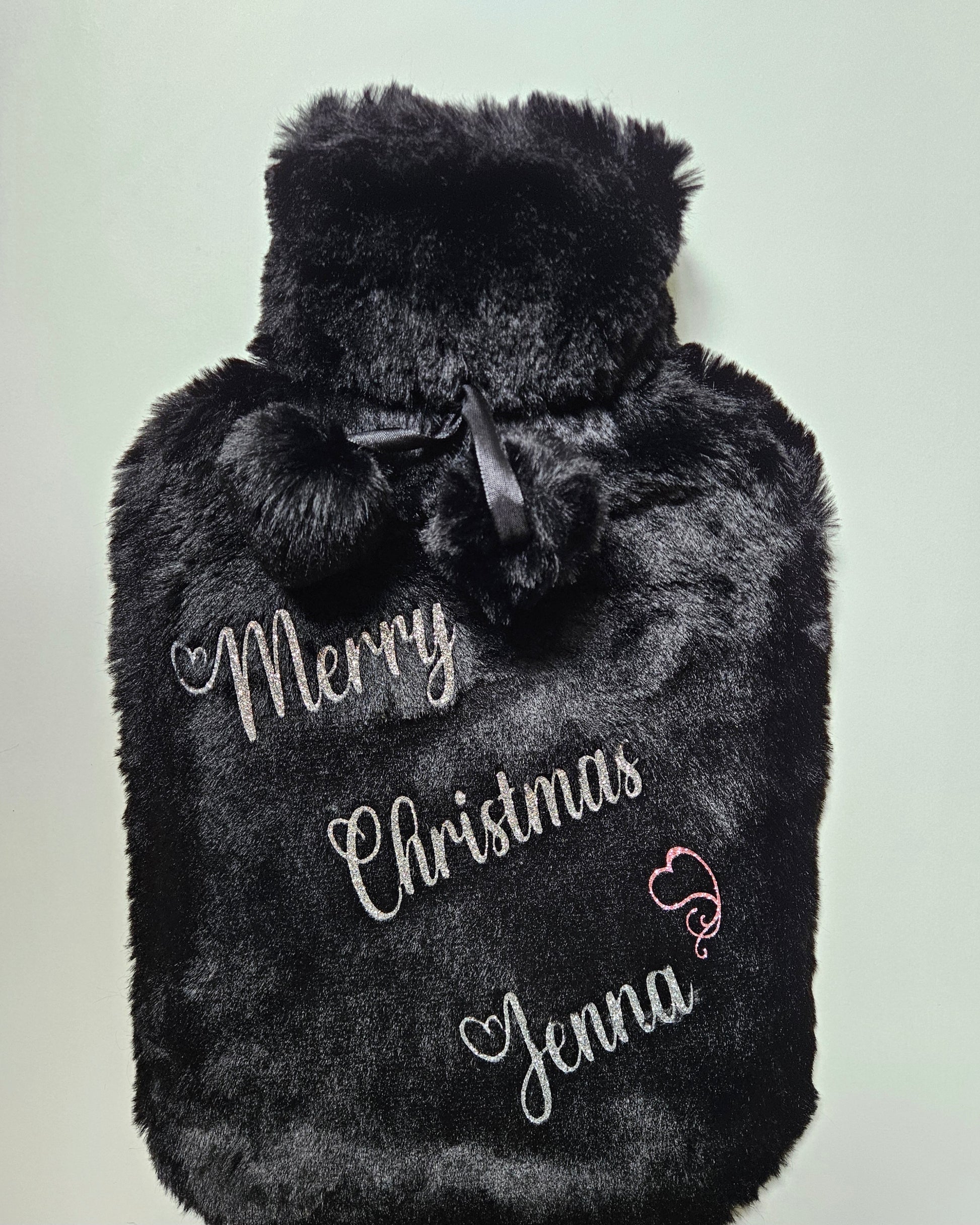 Stay cosy and warm this winter with our luxury personalised xmas hot water bottles. Featuring ultra soft removable covers with pom poms.