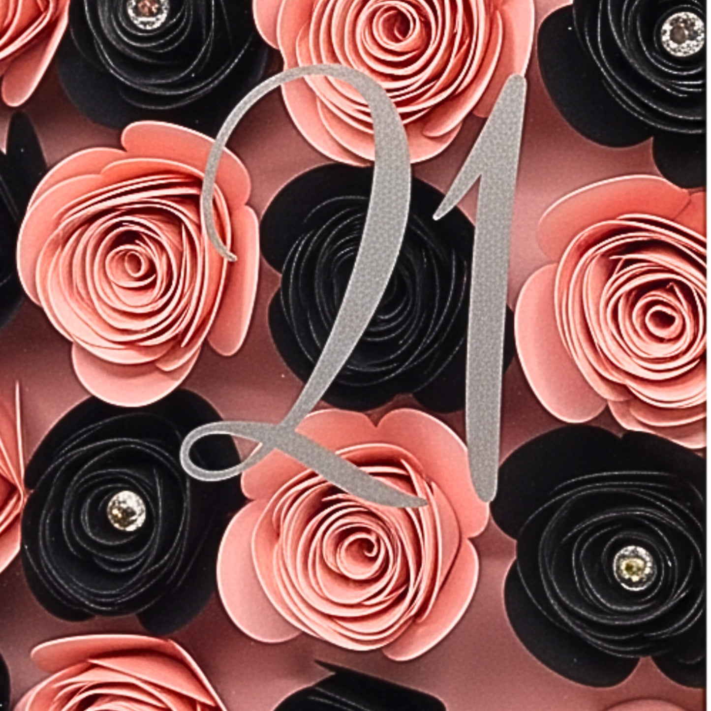 Decorative number '21' surrounded by pink and black flowers with gemstone accents.
