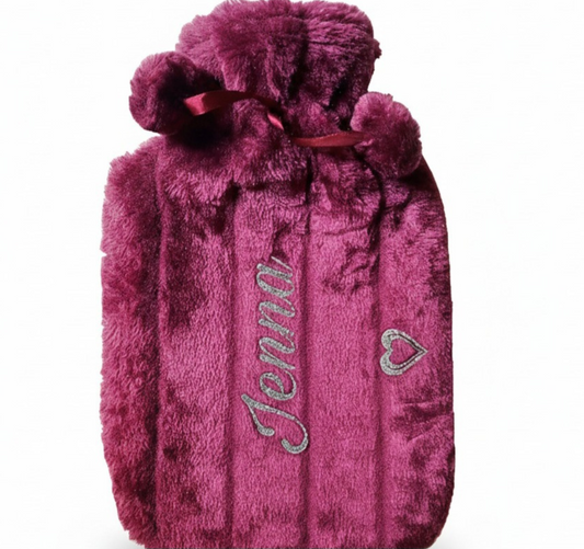 Plum hot water bottle cover with the name  'Jenna' with silver glitter heart on a white background