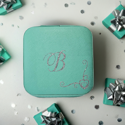 A bespoke, personalised jewellery box gift for her in a trending mint colour case. Perfect for birthdays, special occasions and ideal luxury gifts for bridesmaids. Featuring a silver glitter HTV with a delicate heart border decoration.